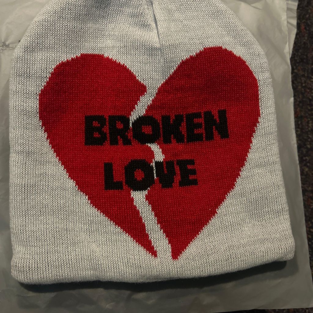 White beanie with red broken love heart design