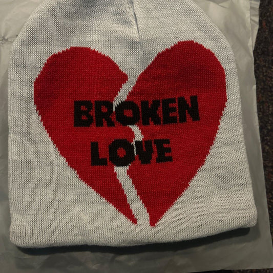 White beanie with red broken love heart design