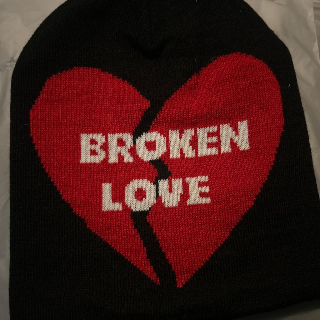Black Broken Love beanie with red heart design