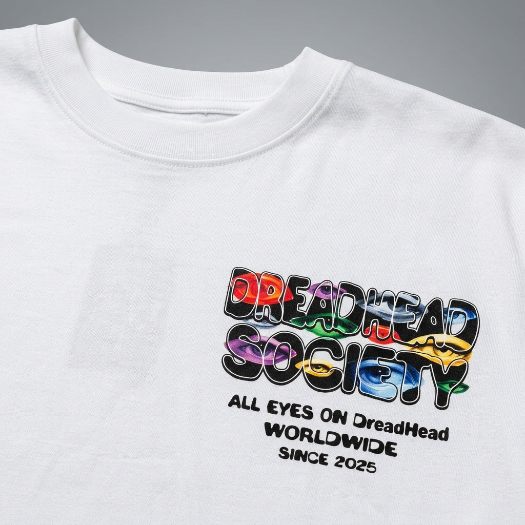 Dreadhead Society Eyes On Us White Graphic Tee Detail Close-Up of Neck Collar and Chest Logo
